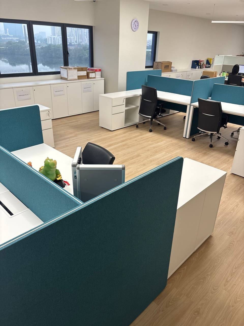 Furnished workstations and low cabinets in the upper office